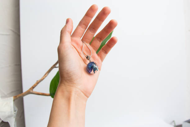istock Real flowers in epoxy resin, jewelry 1319395810