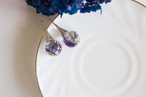 istock Real flowers in epoxy resin, jewelry 1319397372