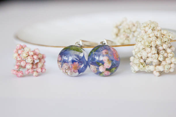istock Real flowers in epoxy resin, jewelry 1319398331
