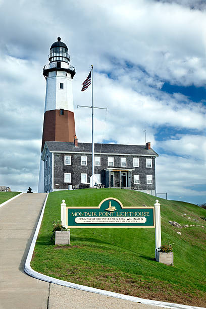 Montauk Point Lighthouse. Montauk Point Lighthouse. View seen from the popular walk leading to the museum and lighthouse. montauk point stock pictures, royalty-free photos & images