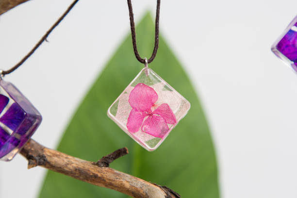 istock Real flowers in epoxy resin, jewelry 1319400592