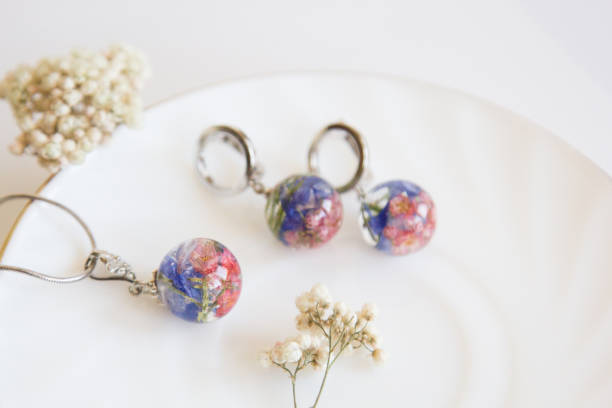istock Real flowers in epoxy resin, jewelry 1319401489