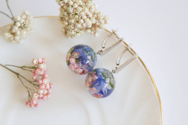 istock Real flowers in epoxy resin, jewelry 1319403201