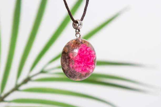 istock Real flowers in epoxy resin, jewelry 1319403219