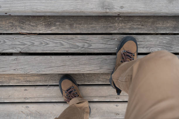 Men Climb the Wooden Steps