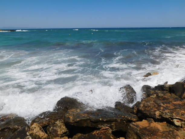 istock waves on the rocky coast. fig tree beach. Protaras. Ayia Napa. Cyprus. 1319407634