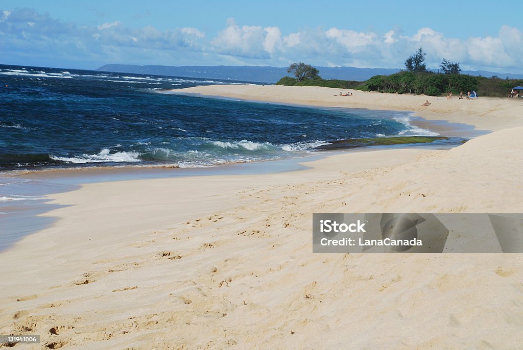 Kaena Point Beach Park in Oahu Kaena Point Beach Park is located west of Wailua on the northwestern tip of the island. It is very popular with local Hawaiians and provides an excellent place to windsurf and kitesurf. Bay of Water Stock Photo