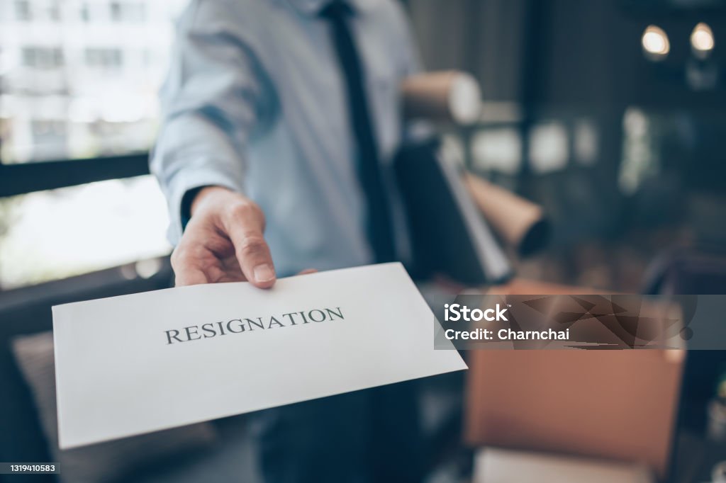 Businessman sending and showing resignation letter to employer boss. Quiting a job, businessman fired or leave a job concpet. Quitting a Job Stock Photo
