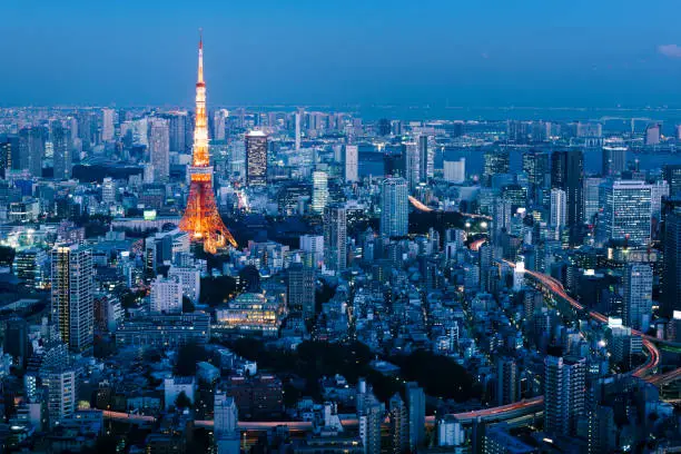 Sunset view of Tokyo Skylines with the Tokyo Tower. Tokyo is both the capital and largest city of Japan.