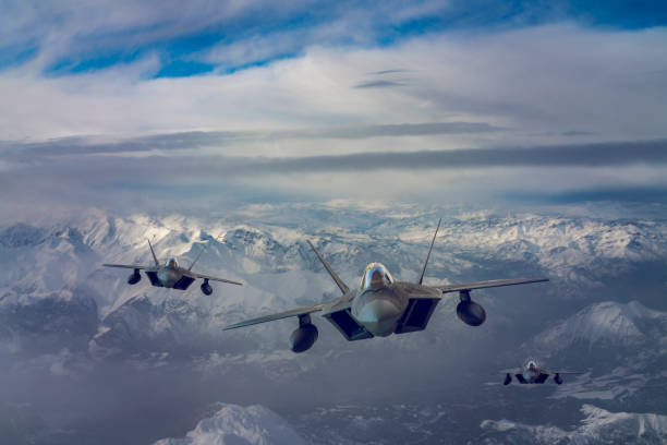 istock Jet fighters flying over the clouds. 1319413645