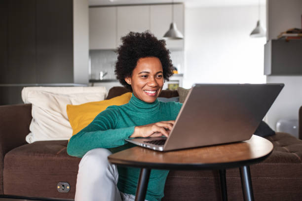istock Woman at home, using laptop 1319420074