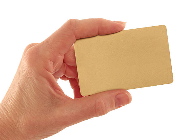 istock Hand Holding Gold Credit Card on White 131942321