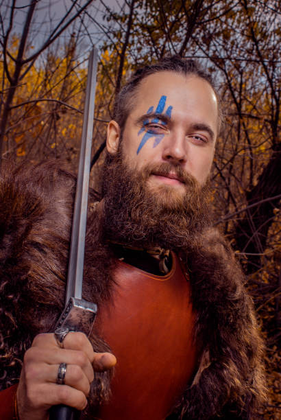 istock Brutal scandinavian warrior with sword 1319425563