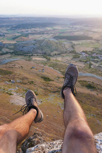 istock On the edge of a cliff during sunrise 1319428206