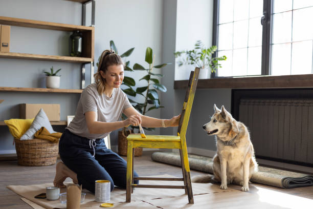 istock Woman at home reparing chair 1319428281