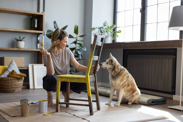 istock Woman at home reparing chair 1319428294