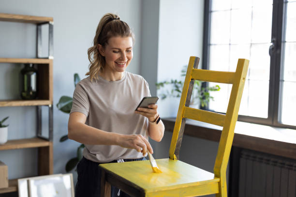 istock Woman at home reparing chair 1319428296