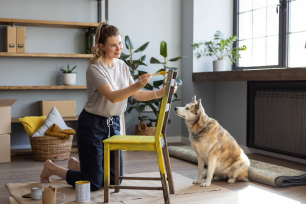 istock Woman at home reparing chair 1319428330