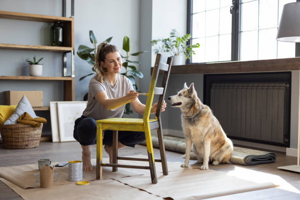 Woman at home reparing chair