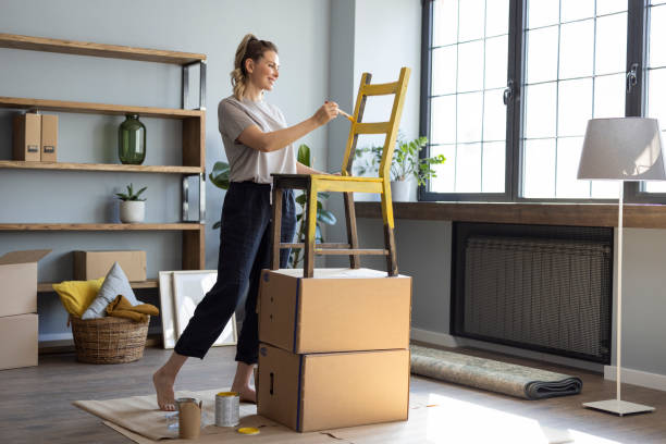 istock Woman at home reparing chair 1319428340