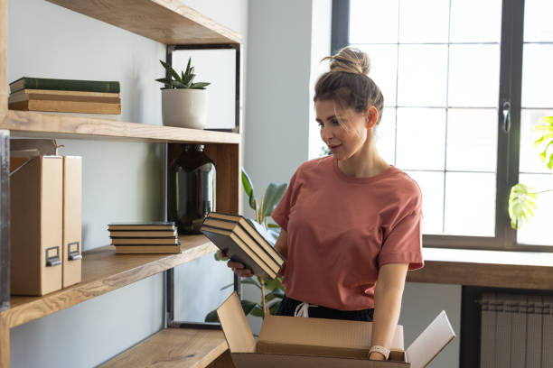 istock omen arranging stuff in new apartment 1319428376