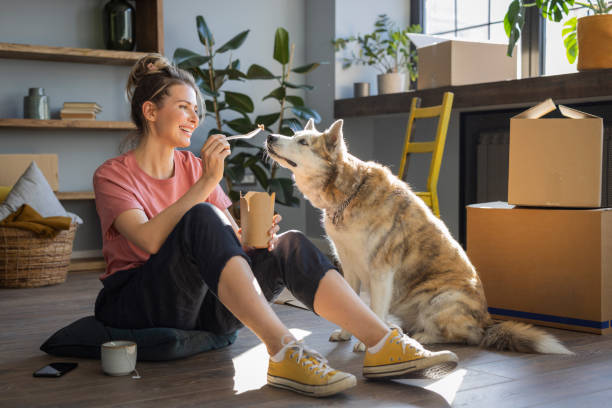 istock Woman moving in new home 1319428480