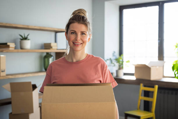 istock Woman moving in new home 1319428533
