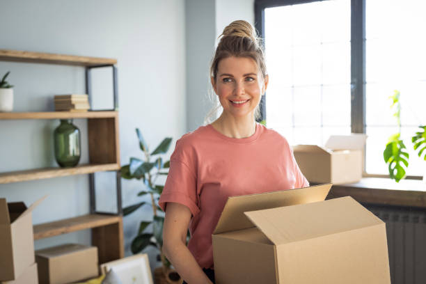 istock Woman moving in new home 1319429219