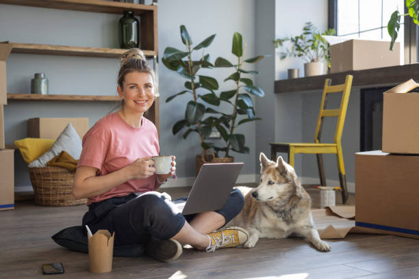 istock Woman moving in new home 1319429283
