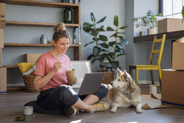 istock Woman moving in new home 1319429360