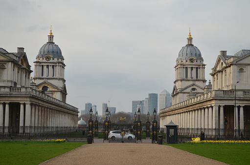 The view on the Canary Wharf skyscrapers from the Royal Naval College in London - symmetrical buildings of the college make a perfect frame.