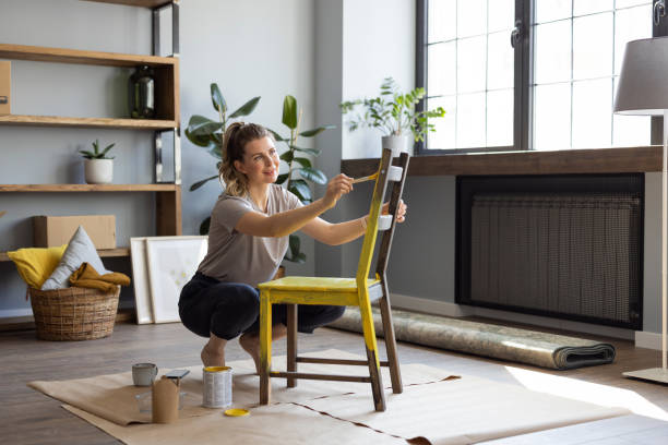 istock Woman at home reparing chair 1319431717