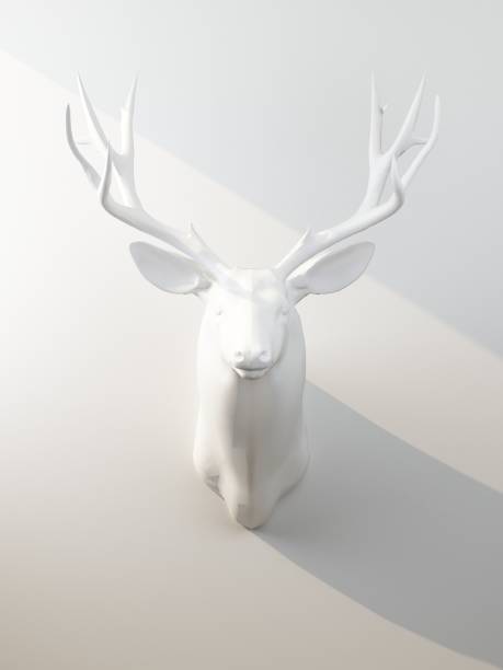 istock white deer head on white wall illuminated by beam of light 1319434263