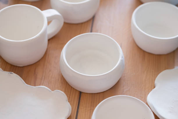 istock Handmade ceramics before firing standing on table 1319437120