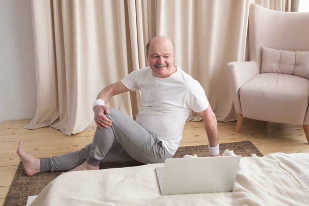 istock Senior caucasian man doing yoga Spine twisting pose 1319437707