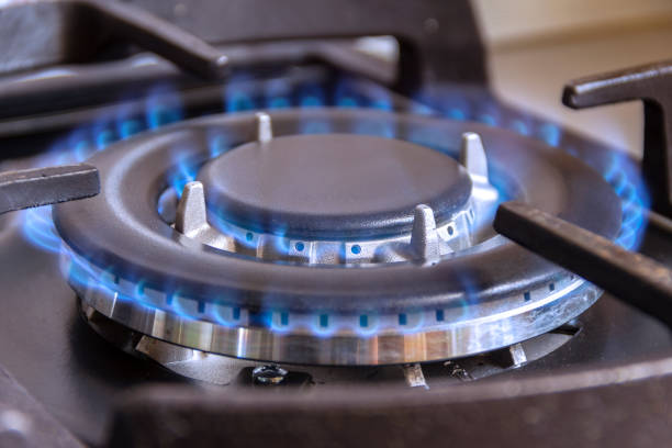 a burning gas burner in the kitchen. - natural gas gas burner flame imagens e fotografias de stock