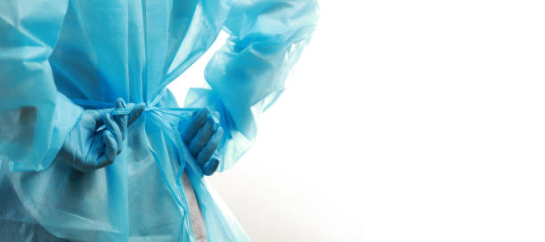 Medical worker wearing a  protective medical suit to protect against coronavirus stock photo