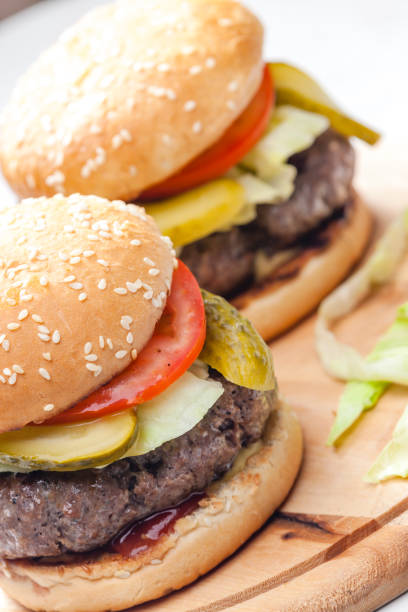 istock homemade hamburger with pickled cucumber and tomato 1319446411