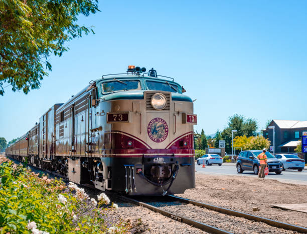Front shot of the Napa Valley Wine Train on sunny day. Napa, CA / USA - July 15, 2015: The Napa Valley Wine Train. It's a privately-operated excursion train that runs between Napa and St. Helena, passing through vineyards and wineries. napa california stock pictures, royalty-free photos & images