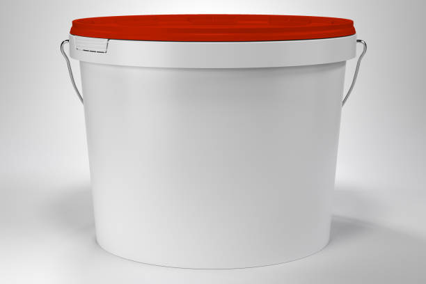 istock Blank white paint bucket with handle and red lid on white neutral background front view 1319456970