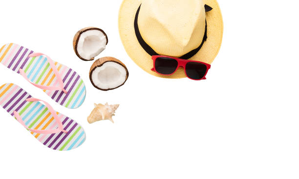 istock Summer accessories. Shoes, shell, hat, coconut, sunglasses. Summertime background isolated on white. Flip flops and food top view. Striped slippers 1319457539