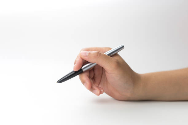 istock Cropped hand with fountain pen is writing on paper 1319458129