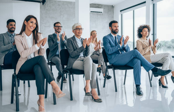 istock Businesspeople applauding during a seminar in conference hall. 1319458290