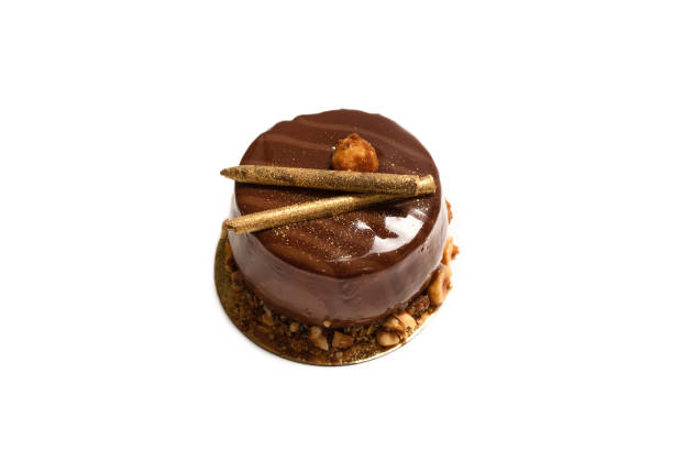 istock Chocolate and caramel cake isolated on a white background. 1319462403