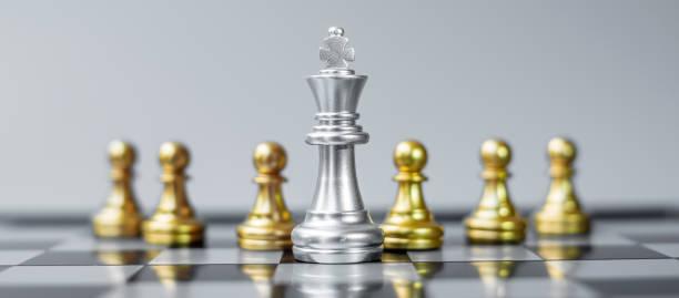 istock Chess king figure Stand out from the crowd on Chessboard background. Strategy, leadership, business, teamwork, different, Unique and Human resource management concept 1319462817