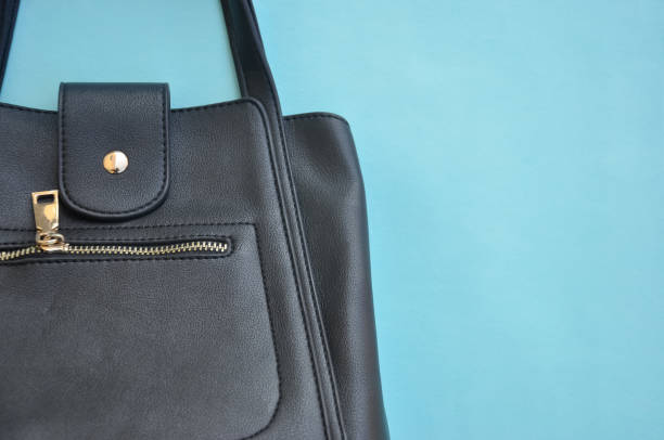 istock High angle view of premium black color leather handbag with negative space 1319465041