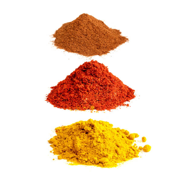 istock turmeric, paprika, cinnamon powders on white 1319465519