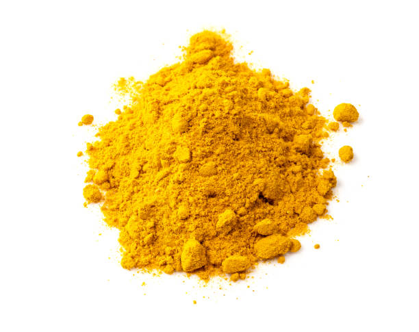 istock handful of Turmeric powder closeup on white 1319465523