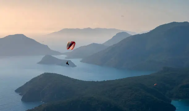 Photo of Paragliding over the Blue Lagoon Oludeniz over the sea and mountains in turkey