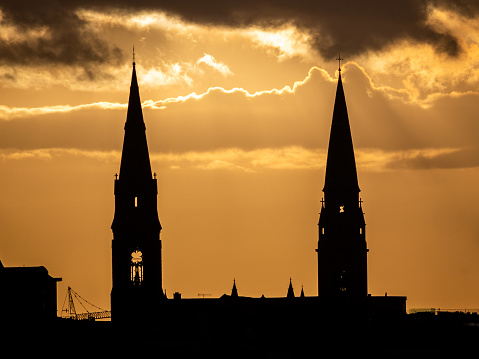 Two Church Spires Silhouette on a Golden Sunset, Ireland